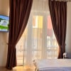 https://cdn-ostrovok-ru-ion.test.edgekey.net/t/100x100/hotel_review/e1/79/e179693afca1a677560283e2223ff101f448d285.JPEG